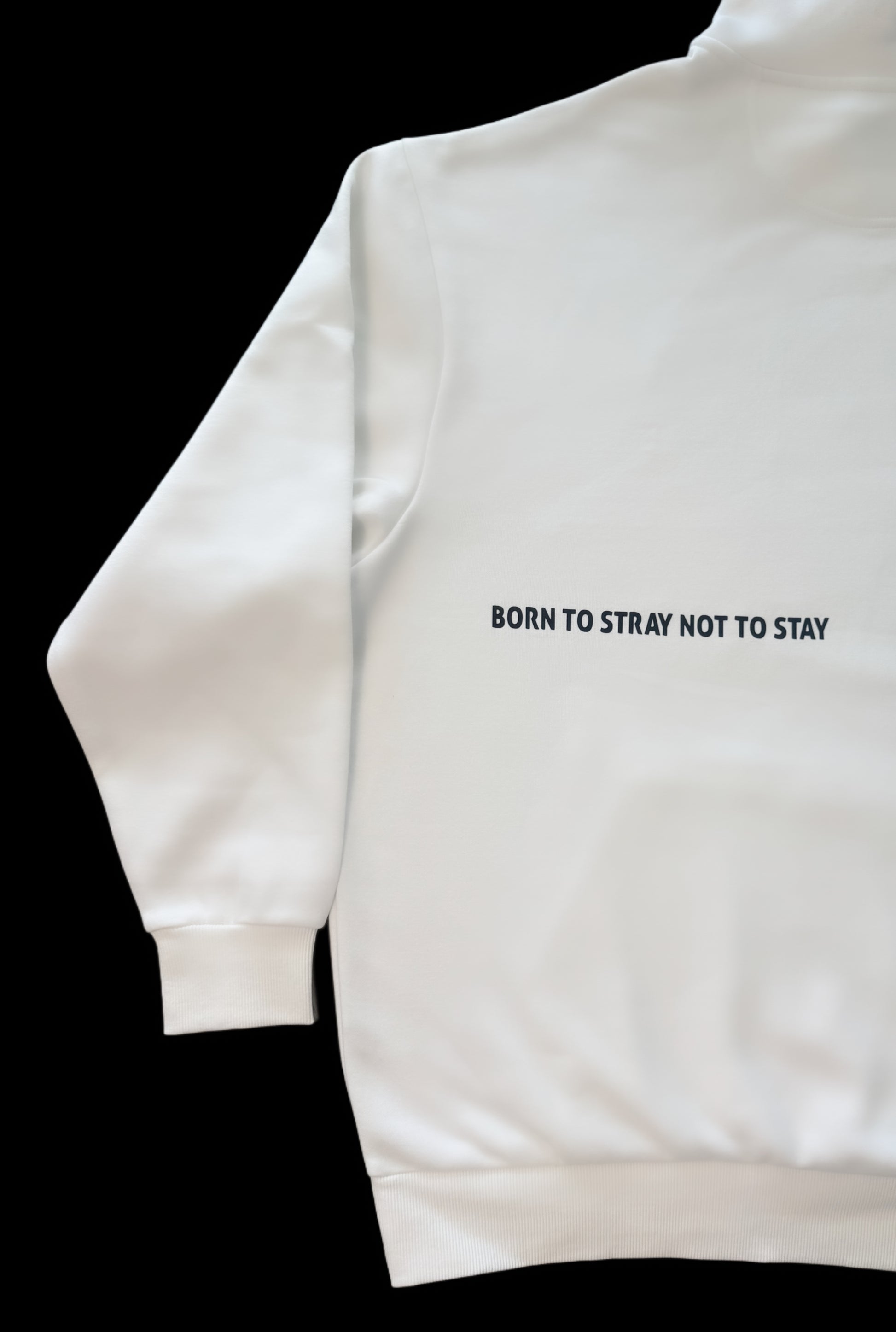 White hoodie with slogan Born to Stray not to Stay on back